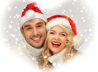 Image showing family couple in sweaters and santa's hats