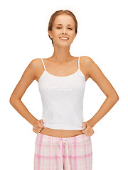 Image showing happy and smiling woman in cotton pajamas