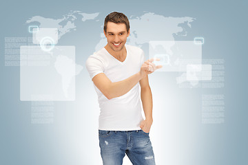 Image showing handsome man working with touch screen