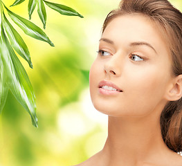 Image showing beautiful woman with green leaves