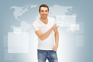 Image showing handsome man working with touch screen