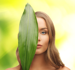 Image showing woman with green leaf