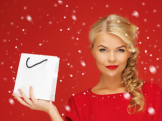 Image showing lovely woman in red dress with shopping bag