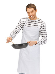 Image showing handsome man with pan and spoon