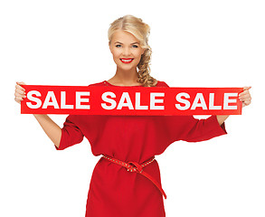 Image showing lovely woman in red dress with sale sign