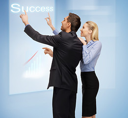 Image showing man and woman working with virtual touch screens