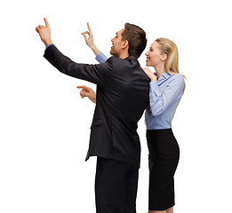 Image showing man and woman working with something imaginary