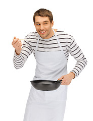 Image showing handsome man with pan and spoon