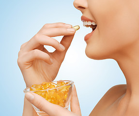 Image showing woman with vitamins