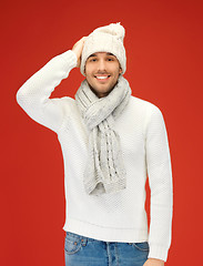 Image showing handsome man in warm sweater, hat and scarf