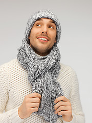 Image showing handsome man in warm sweater, hat and scarf