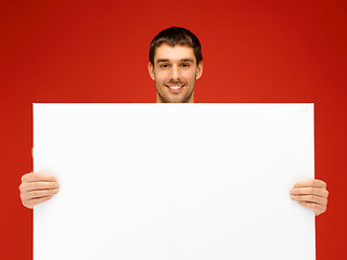 Image showing handsome man with big blank board