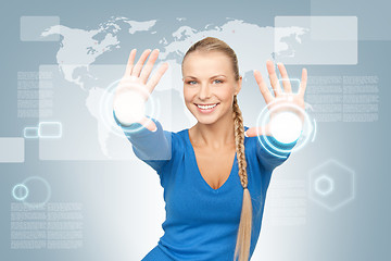 Image showing businesswoman working with touch screen