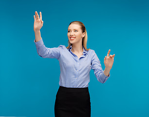 Image showing woman working with something imaginary