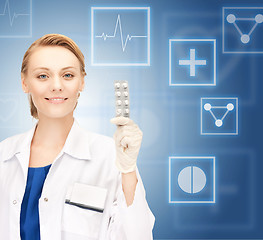 Image showing attractive female doctor with pills