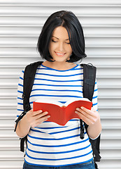 Image showing woman with bag and book