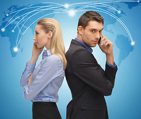 Image showing man and woman with cell phones