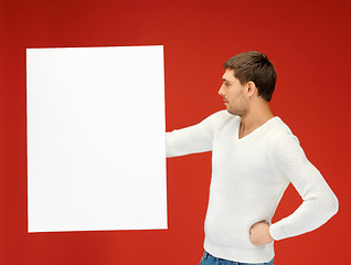 Image showing handsome man with big blank board