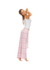 Image showing woman in pajamas doing morning exercise