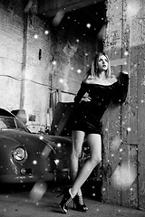 Image showing fashionable woman in retro garage