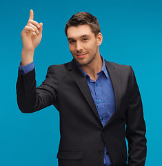 Image showing man in suit with his finger up