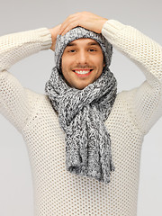 Image showing handsome man in warm sweater, hat and scarf