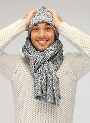 Image showing handsome man in warm sweater, hat and scarf