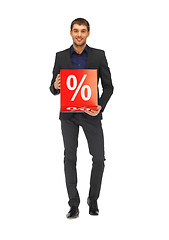 Image showing handsome man in suit with percent sign