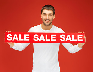 Image showing handsome man with sale sign