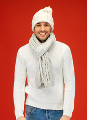 Image showing handsome man in warm sweater, hat and scarf