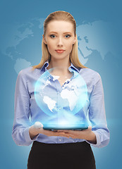 Image showing woman with tablet pc and virtual earth