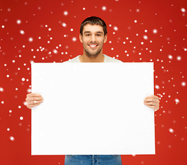 Image showing handsome man with big blank board