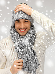 Image showing handsome man in warm sweater, hat and scarf