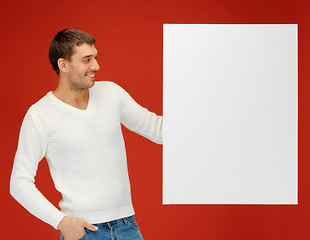 Image showing handsome man with big blank board