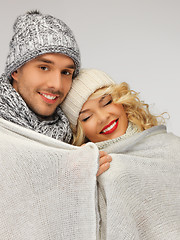 Image showing family couple under warm blanket
