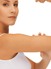 Image showing sporty woman flexing her biceps