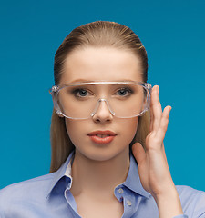 Image showing businesswoman in protective glasses