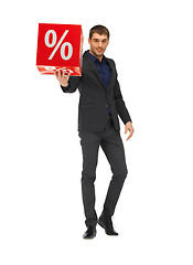 Image showing handsome man in suit with percent sign