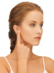 Image showing woman pointing to ear