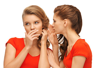 Image showing two talking teenage girls in red t-shirts