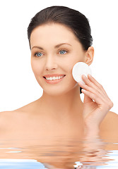 Image showing beautiful woman with cotton pad in water