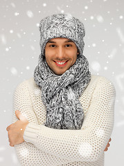 Image showing handsome man in warm sweater, hat and scarf