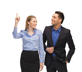 Image showing man and woman pointing their fingers