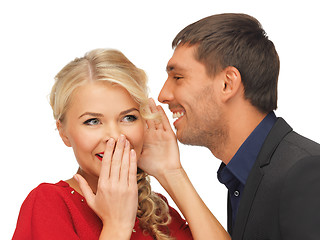 Image showing man and woman spreading gossip