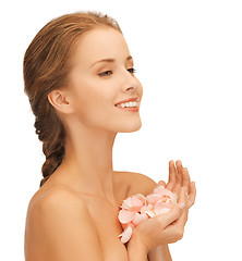 Image showing beautiful woman with rose petals