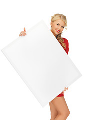 Image showing lovely woman in red dress with blank board