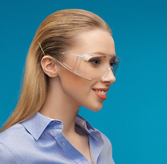 Image showing businesswoman in protective glasses