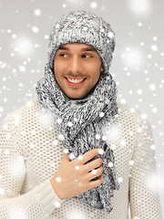 Image showing handsome man in warm sweater, hat and scarf