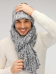 Image showing handsome man in warm sweater, hat and scarf