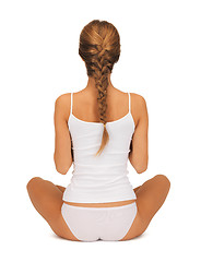 Image showing woman in undrewear practicing yoga lotus pose